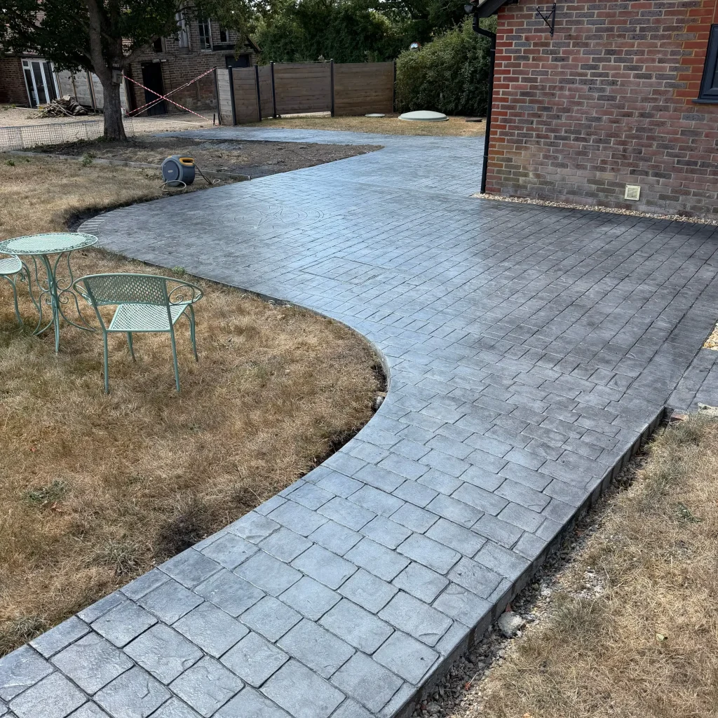 grey-stamped-concrete-curved-path-garden