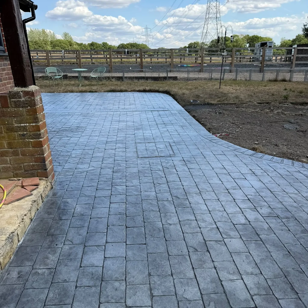 grey-stamped-concrete-patio-open-fields