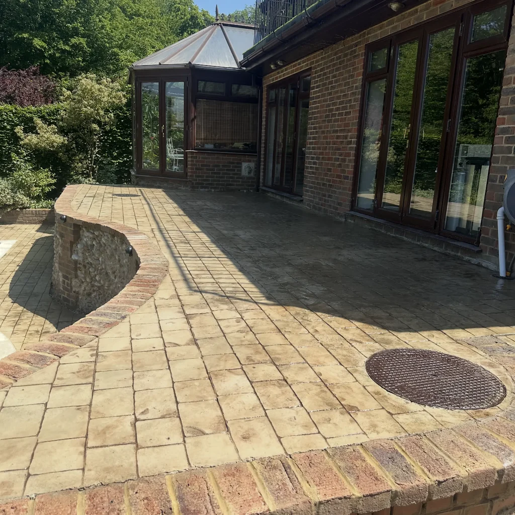 sandstone-stamped-concrete-patio-conservatory